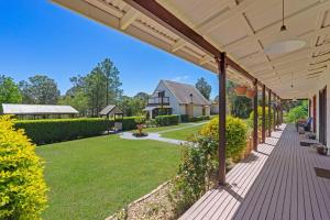 an empty porch of a house with a yard at Firefly Resort in Firefly