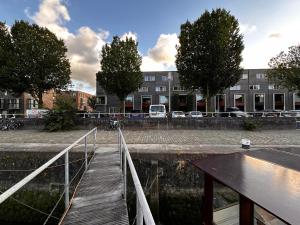 a bridge over a body of water in a city at B&B Unitas Rotterdam in Rotterdam