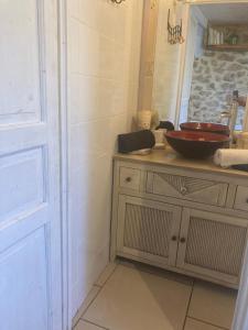 a bathroom with a sink and a bowl on a counter at Le Mafaté - Vallée de l'Eyrieux in Saint Maurice en Chalencon
