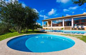 an image of a swimming pool in front of a house at Sa Font Den Ros in Son Servera