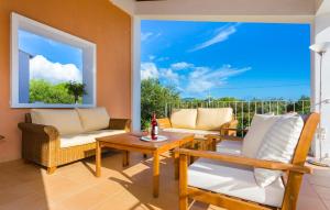 a living room with a table and chairs at Sa Font Den Ros in Son Servera