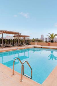 a large pool with blue water in a hotel at Sheraton Lima Historic Center in Lima