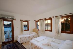 Ein Bett oder Betten in einem Zimmer der Unterkunft Baba Veli Pension