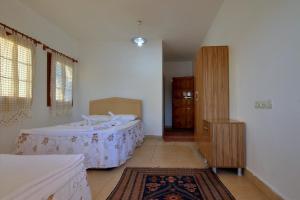 Ein Bett oder Betten in einem Zimmer der Unterkunft Baba Veli Pension