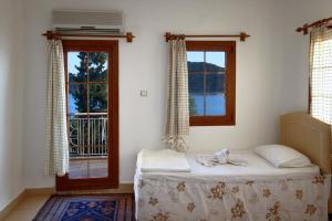 Ein Bett oder Betten in einem Zimmer der Unterkunft Baba Veli Pension