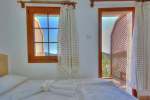 Ein Bett oder Betten in einem Zimmer der Unterkunft Baba Veli Pension