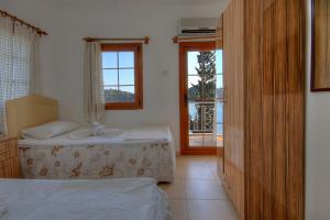 Ein Bett oder Betten in einem Zimmer der Unterkunft Baba Veli Pension