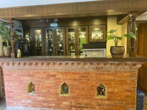 a brick fireplace in front of a building at Hotel Malla Inn in Bhaktapur