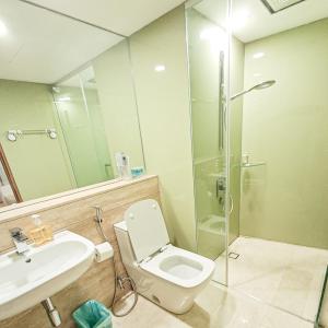 a bathroom with a toilet and a sink and a shower at Vortex suites klcc by ARICA in Kuala Lumpur +22 photos