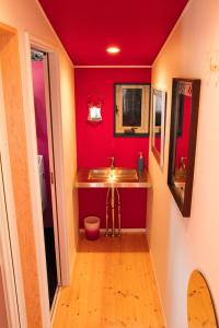 a small bathroom with a sink and a toilet at Mrs. Maroulla's HOUSE in Naoshima