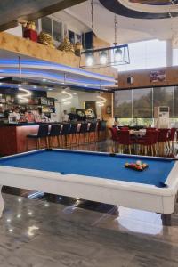 a pool table in a room with a bar at One Bedroom Condominium at Kandi Tower 2 in Angeles