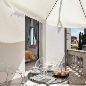 a table with a tray of croissants on a balcony at Villa Garibaldi in Bettolle