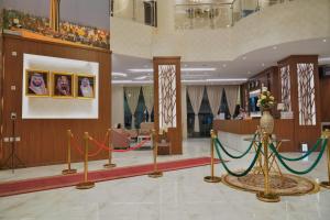 a lobby with some ropes in the middle of a building at شقق سما الرفاع للشقق المخدومة in Al Kharj