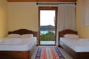 Ein Bett oder Betten in einem Zimmer der Unterkunft Baba Veli Pension