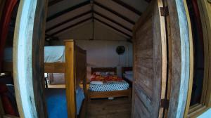 a small room with a bunk bed and a bunk bed at Cabañas Isla Bonita in Puerto Limón +39 photos
