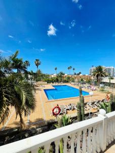 a view of the pool from the balcony of a resort at Ocean View Luxury Las Americas in Playa de las Americas