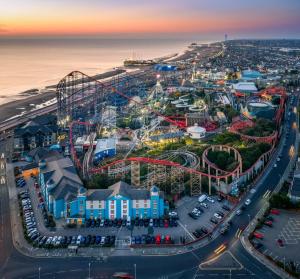 an aerial view of a roller coaster at a carnival at The Big Blue Hotel - Blackpool Pleasure Beach in Blackpool