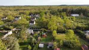an aerial view of a yard with houses and trees at Roulotte rêve de bohème in Moisson