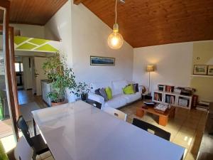 a living room with a table and a couch at Casa Avezza in Omegna
