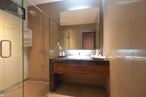 a bathroom with a sink and a shower and a mirror at Burapa Boutique in Chiang Mai +68 photos