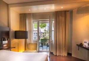 Postel nebo postele na pokoji v ubytování Golden Tulip Ampt van Nijkerk