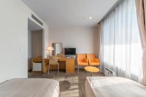 Postel nebo postele na pokoji v ubytování Hotel Landmark Wakayama