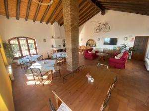 an overhead view of a living room with tables and chairs at La Ventera - Casa Rural in Gualchos