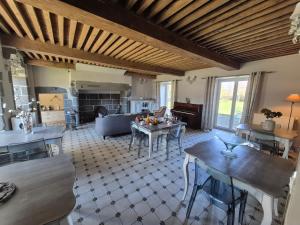 a living room with a table and a couch at La Bâtisse de Bromont in Bromont-Lamothe