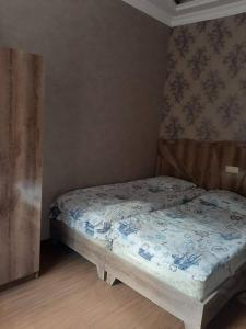 a small bedroom with a bed in a room at Guest house in Jermuk