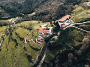 an aerial view of a house on a hill at Alqueiturismo - Casas de Campo in Guarda