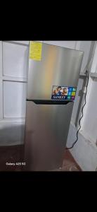 a refrigerator with a picture on the front of it at Casa,del vozque in Manzanillo