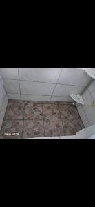 a bathroom with a tile floor and a tile floor at Casa,del vozque in Manzanillo +18 photos