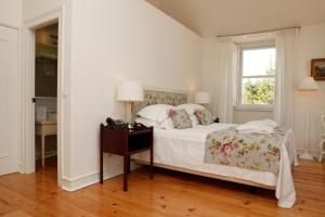 Кровать или кровати в номере Hotel Casa Palmela - Small Luxury Hotels of The World, Hotel & Villas