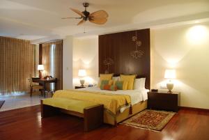 A bed or beds in a room at The Lalit Temple View