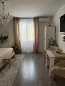 a large living room with a bed and a table at Rooms Zana in Split