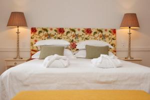 Кровать или кровати в номере Hotel Casa Palmela - Small Luxury Hotels of The World, Hotel & Villas