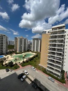an aerial view of a parking lot with buildings at Pool View Studio Apartment Caesar Resort & Spa in Dherinia