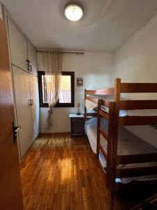 a bedroom with a bunk bed and a window at Kuca Mir Seaside Apartments - 50m from Beach in Ugljan