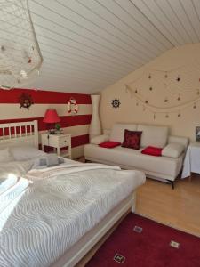 two beds in a room with red and white stripes at Zum Blumentritt in Sankt Aegyd am Neuwalde