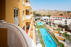 a view of a pool from the balcony of a hotel at Villa De Adeje Beach in Adeje