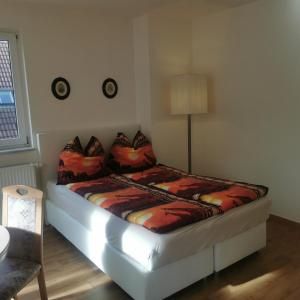 a bed in a room with at FEWO Radebeul Am Waldrand Spittelholz in Radebeul