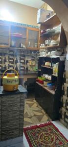a kitchen with a table and a counter in a room at Home stays 1bhk in Jammu