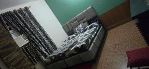 a large bed in a room with at Home stays 1bhk in Jammu