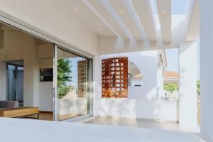 a view of the living room from the bedroom of a house at Villa Jolanta in Sevastí