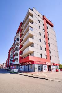 a large apartment building on a city street at Princess Cozy Home Casy in Timişoara