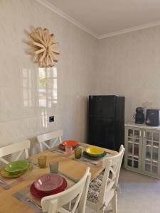 a dining room with a wooden table and chairs at Casa Gelín Verde in Santillana del Mar