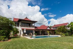 a house with a swimming pool in the yard at PRIVATE SEA VIEW VILLA Eden Island in Eden Island