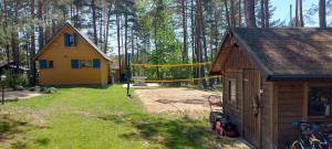 a house with a yellow tape in front of a house at Nartówka in Narty
