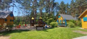 a playground in a yard with at Nartówka in Narty