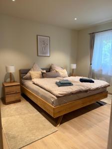 a bedroom with a bed with two pillows on it at Ferienhaus Senzig Waldesruh in Königs Wusterhausen